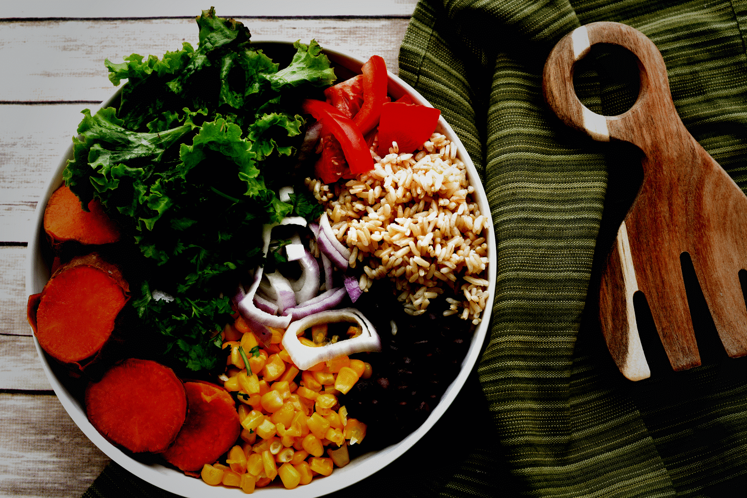 A colourful high-fibre bowl of beans, brown rice, sweet potato and vegetables