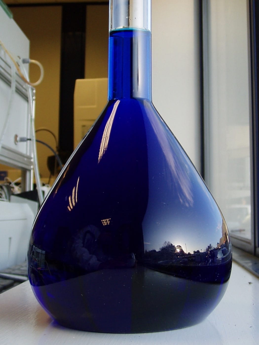 Deep blue methylene blue solution in a laboratory flask