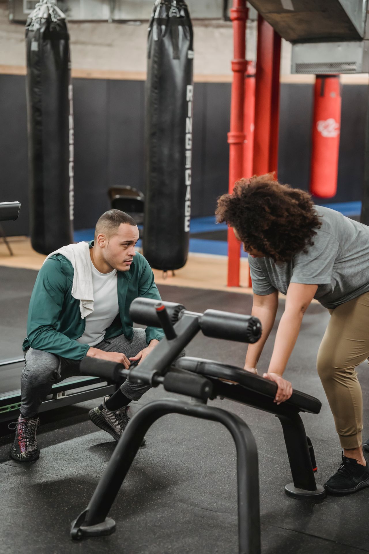 Personal trainer coaching a client toward a healthier lifestyle