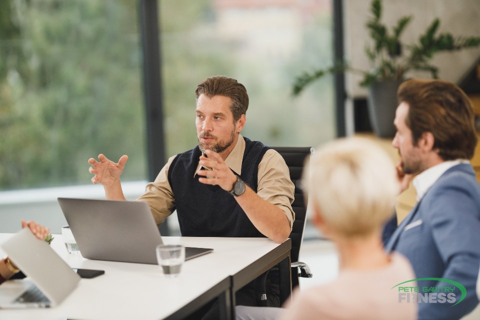 Fit, healthy professionals in a meeting in a plant-filled office