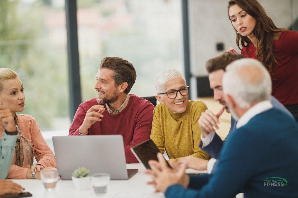 A healthy, energised team collaborating in a bright modern office