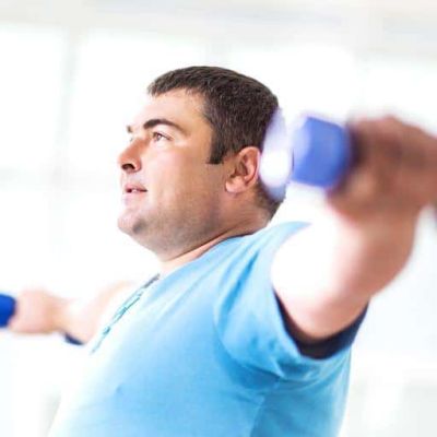 fat-man-exercising-with-dumbbells-539258705-5ae3ba28ff1b7800364d1a88