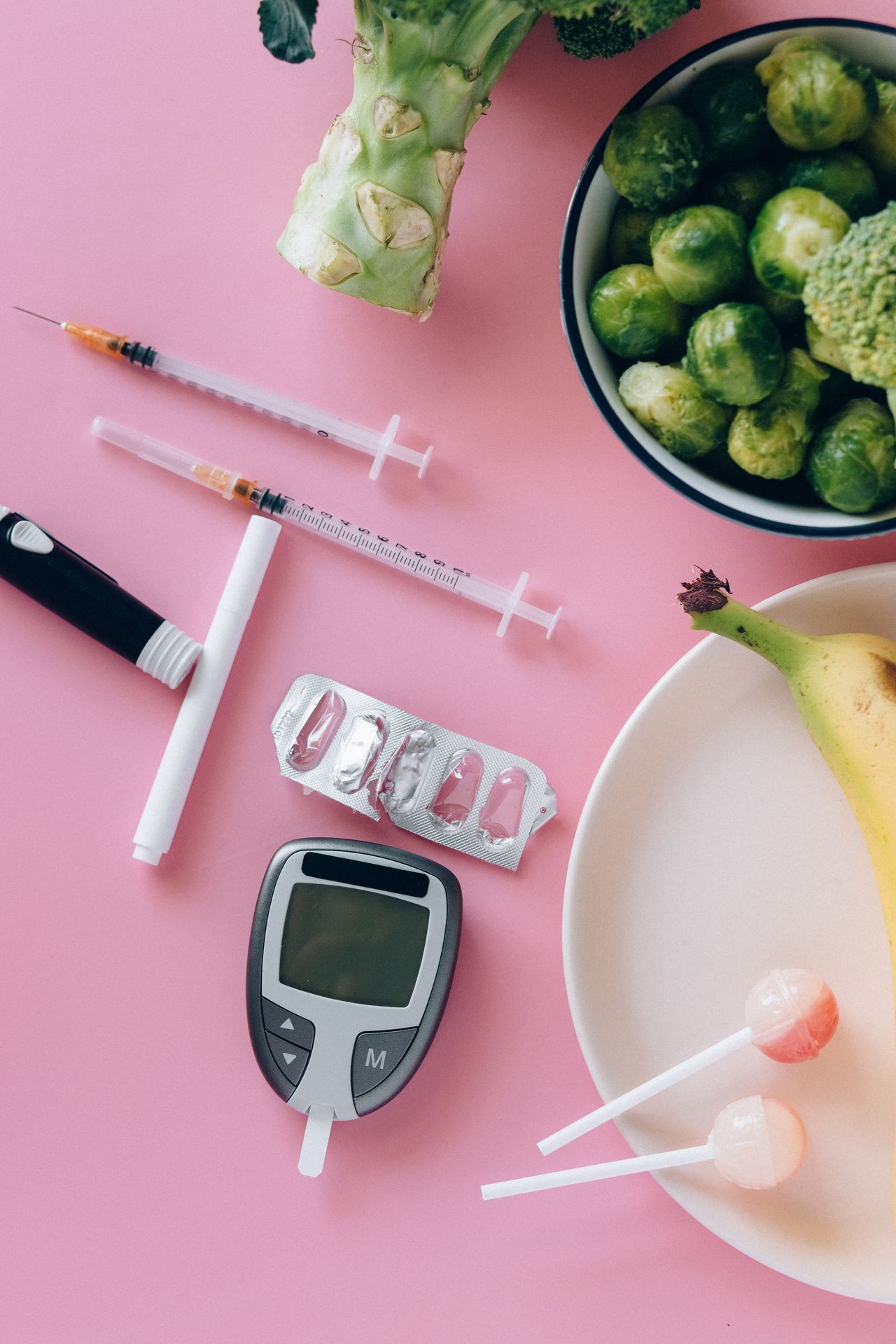 Blood glucose meter with fresh fruit and vegetables