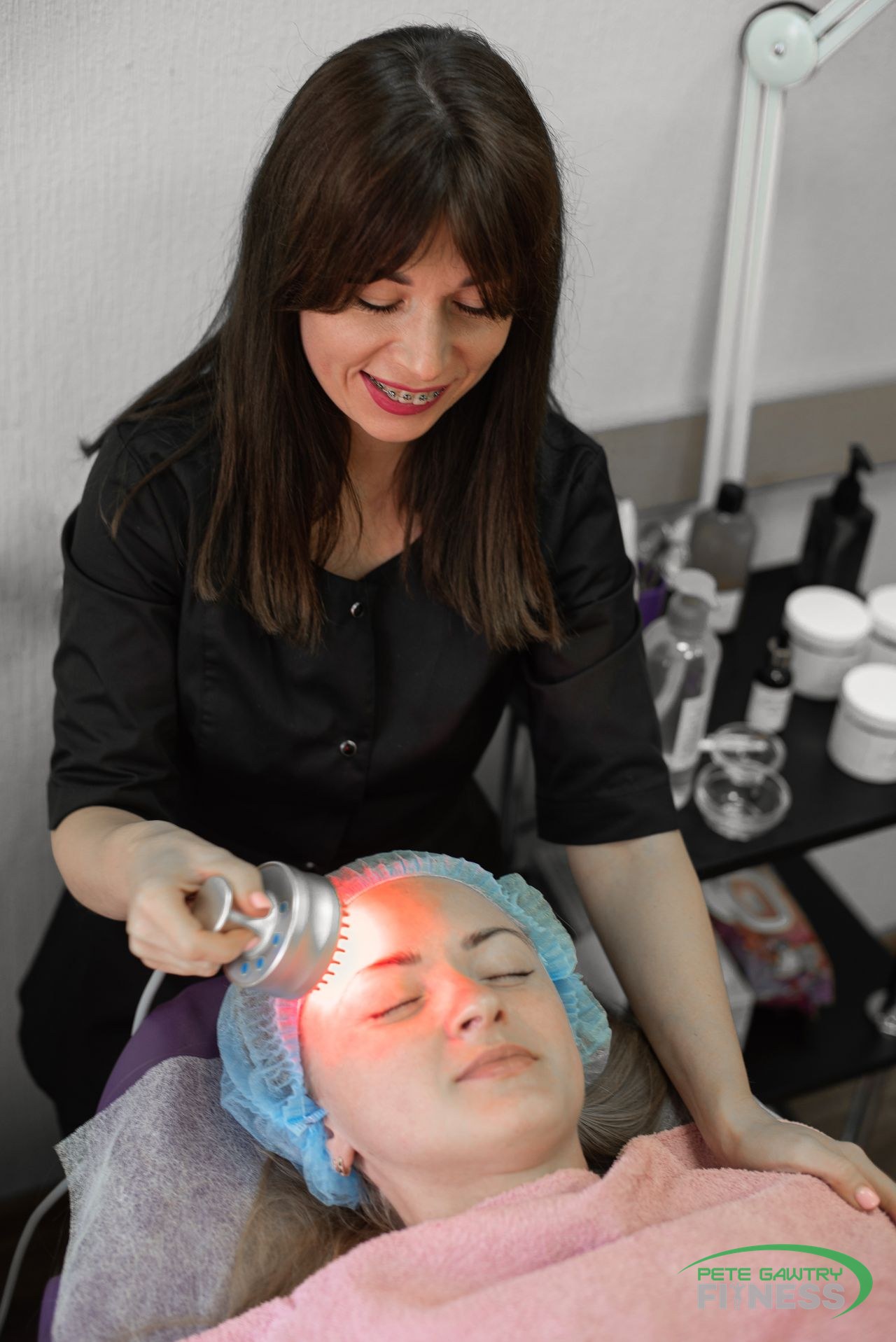Woman receiving an LED light facial treatment